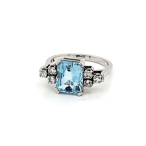 Blue Topaz and Diamond engagement ring in white gold
